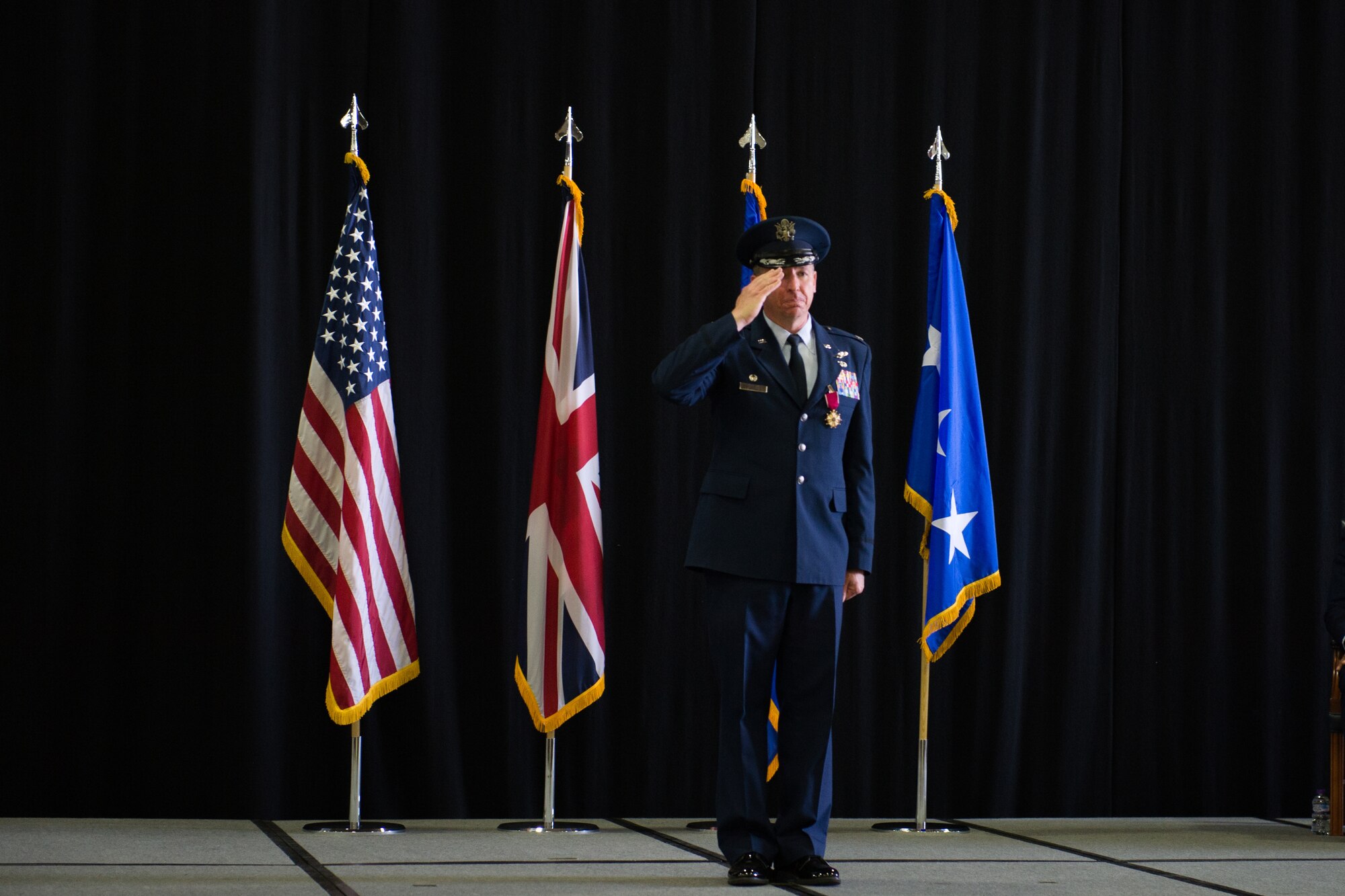 Col. Evan Pettus renders his final salute to Liberty Wing as commander during a change of command ceremony at Royal Air Force Lakenheath, England, July 16, 2018. Pettus has been selected serve as Commandant of the Air Command and Staff College at Maxwell Air Force Base, Ala. (U.S. Air Force photo by Airman 1st Class Shanice Williams-Jones)