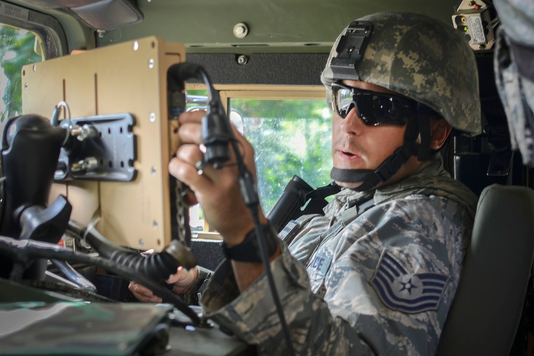 An airman inputs grid coordinates into a Blue Force Tracker System.