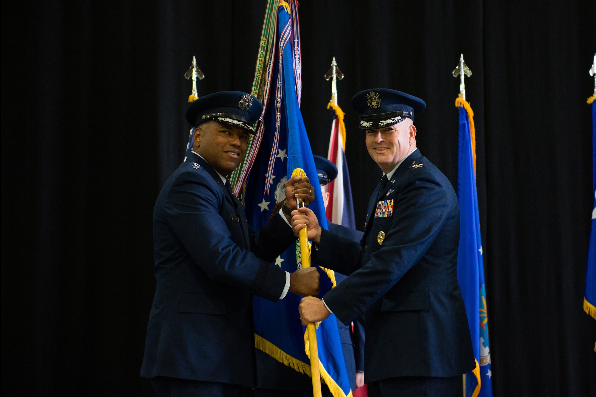Col. William Marshall assumes command of the 48th Fighter Wing from Lt. Gen. Richard Clark, 3rd Air Force commander, during a change of command ceremony at Royal Air force Lakenheath, England, July 16, 2018. Marshall was accompanied by his wife, Lt. Col. Heather Marshall and their two sons. (U.S. Air Force photo by Airman 1st Class Shanice Williams-Jones)
