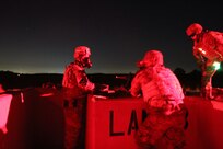 Task Force Ultimate range safety officers engage targets at night