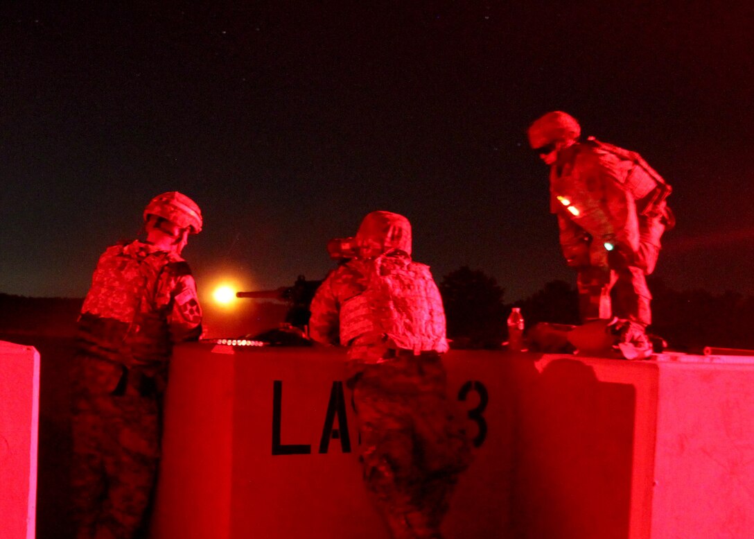 Task Force Ultimate range safety officers engage targets at night