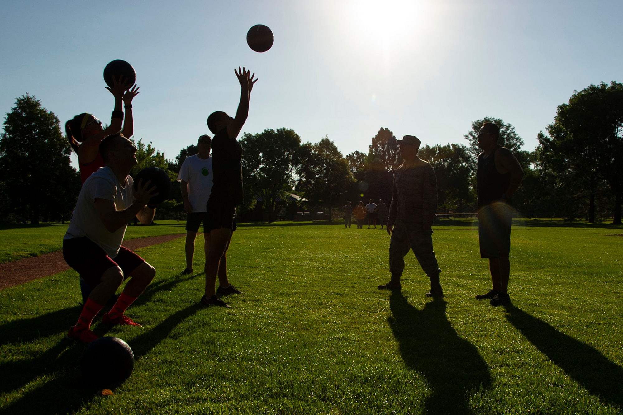 Reservists from the 302nd Airlift Wing perform ball squats during the sixth Annual First Sergeants’ Fitness Challenge, July 15, 2018, at Peterson Air Force Base, Colorado.