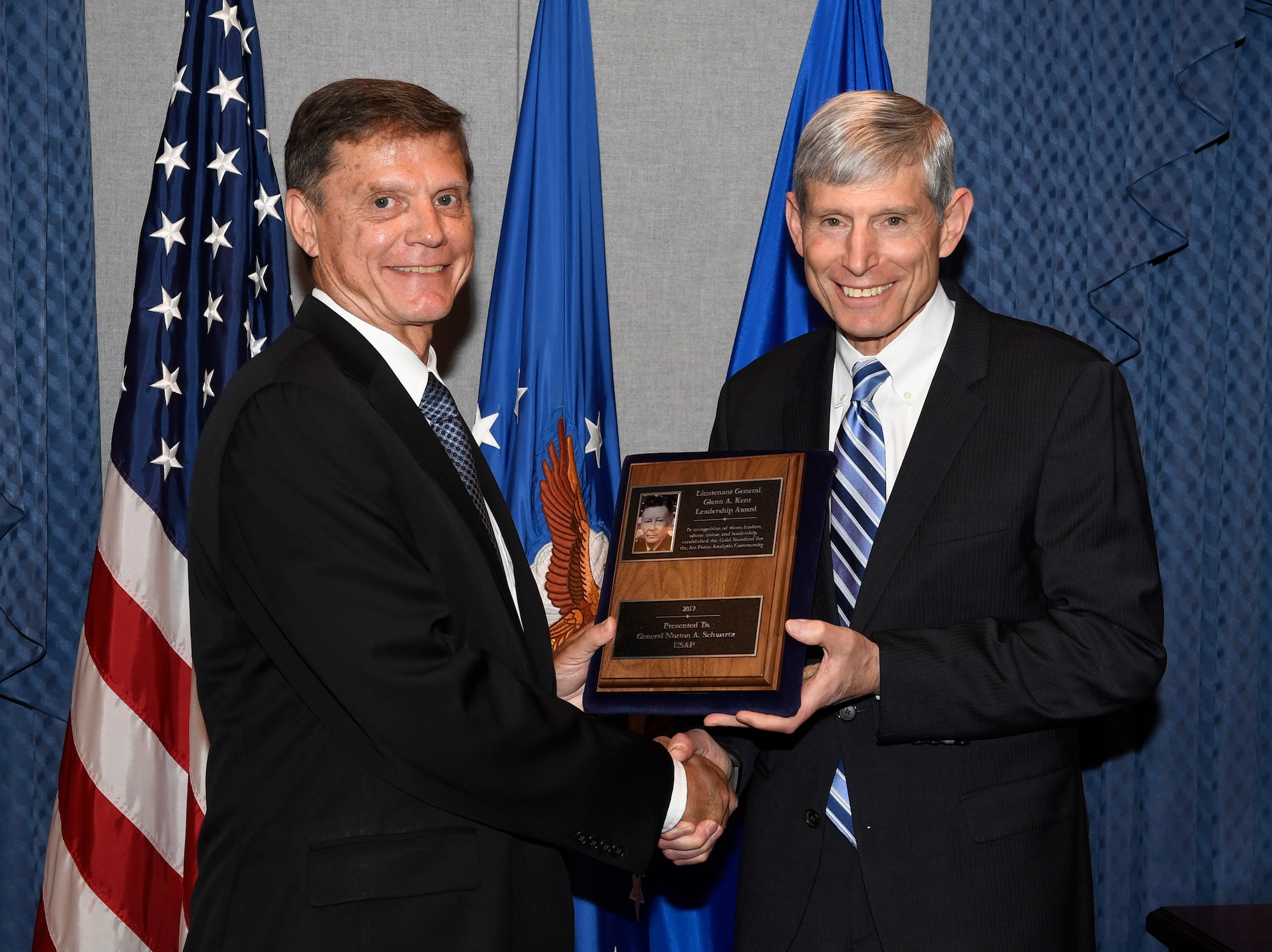 Former Chief of Staff of the Air Force General Norton Schwartz is presented the Lt. Gen. Glenn A. Kent Leadership Award by Kevin Williams, director of Air Force Studies, Analysis and Assessments during a ceremony in the Pentagon, Washington, DC, July 13, 2018. Schwartz served as CSAF from 2008 to 2012.