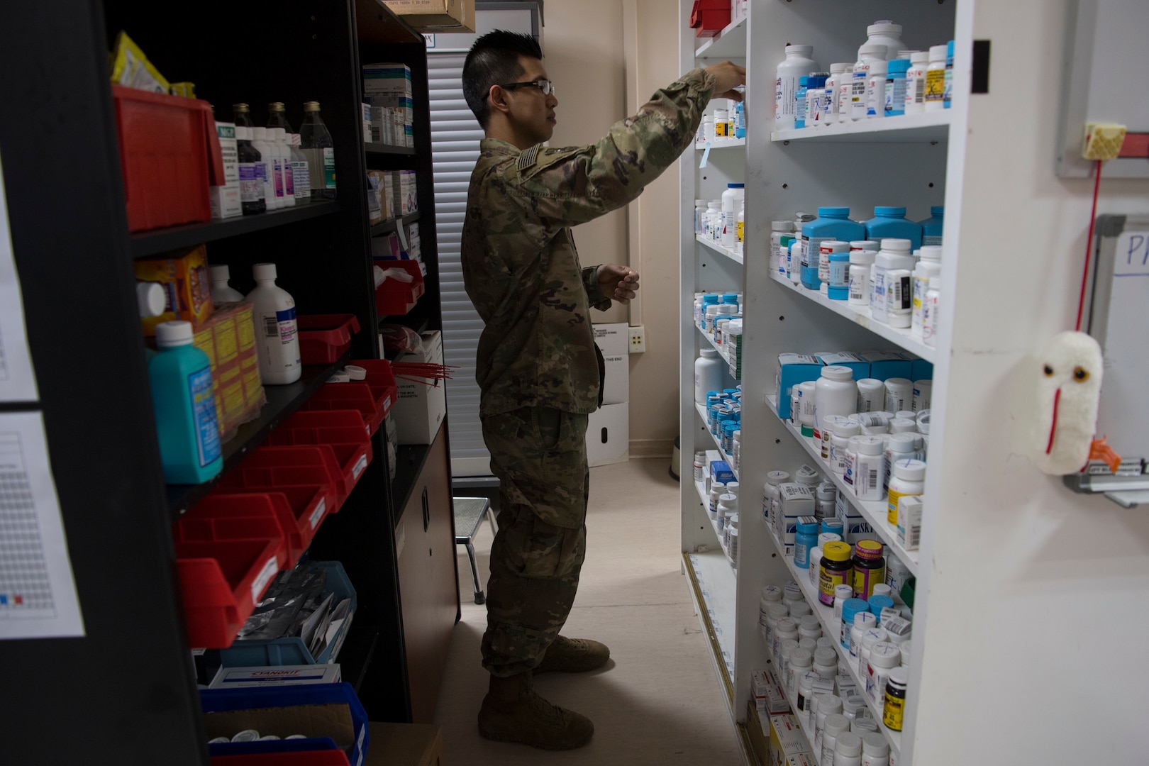 Tech. Sgt. Julian Ray Tayag, 386th Expeditionary Medical Group pharmacy technician from Joint Base San Antonio-Lackland, does inventory of the medication in the pharmacy at an undisclosed location in Southwest Asia May 7, 2018.