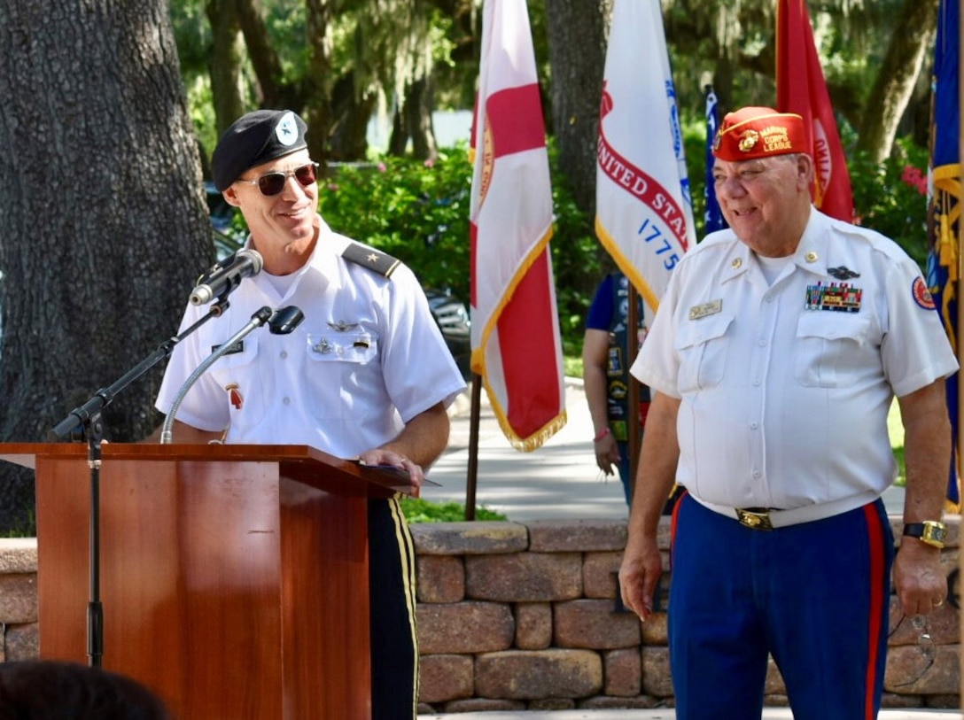 U.S. Army Brig. Gen. Paul Bontrager, U.S. Central Command deputy director of operations, left, and Hillsborough County Veterans Council member Walt Raysick, right, address attendees during a Field of Honor ceremony July 14, 2018 at the Veterans Memorial Park near Tampa, Fla. The ceremony honors the U.S. military and law enforcement personnel who have paid the ultimate sacrifice in the line of duty. (U.S. Air Force photo by Capt. Glenna Lambert)