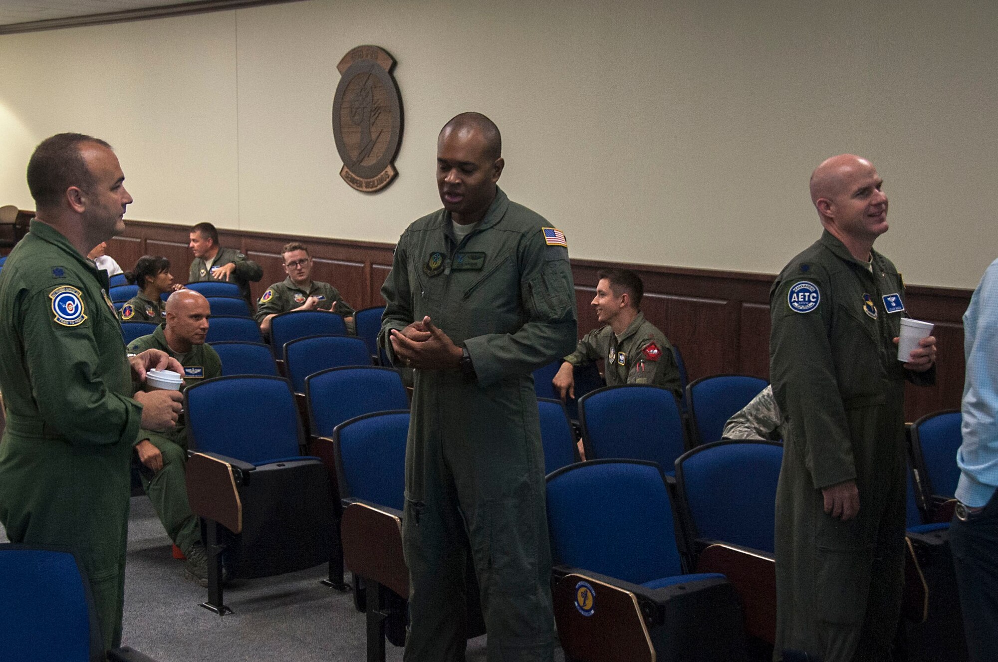 Participants gather inside the Danielson Auditorium for day two of the Air Education and Training Command Remotely Piloted Aircraft Training Enhancement Summit at Joint Base San Antonio-Randolph, Texas, July 11, 2018. AETC officials hosted the three-day summit led by four different program managers that represented graduate and undergraduate RPA training systems and training programs across the Air Force. (U.S. Air Force photo by Tech. Sgt. Ave I. Young)
