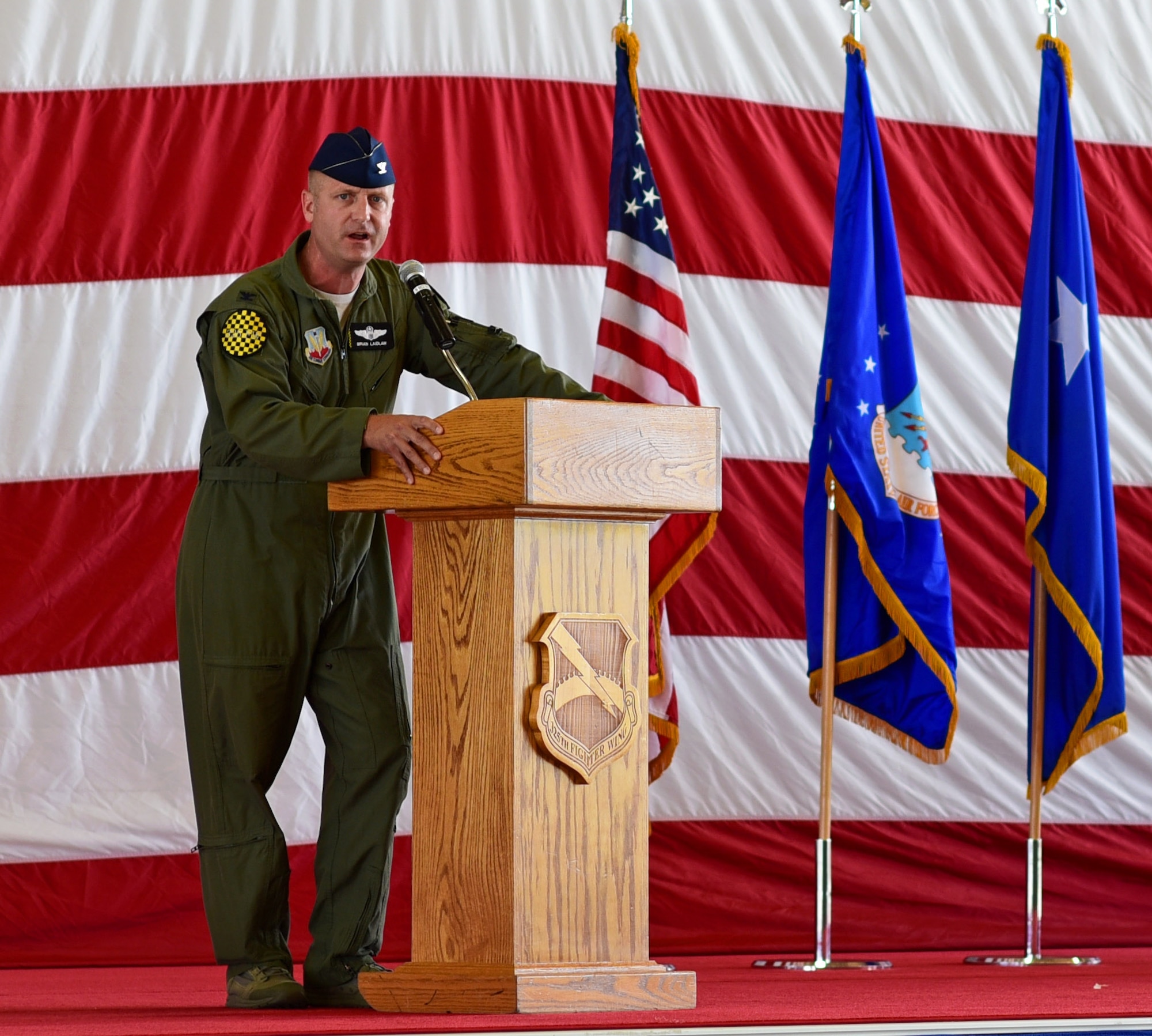 U.S. Air Force Col. Brian Laidlaw speaks to those in attendance during the wing change of command ceremony.