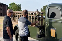 Clayton Garland and Nathan Garland, decedents of late Chief Warrant Officer Louis F. Garland, view a historic firetruck on Goodfellow Air Force Base, Texas, July 13, 2018. The truck is one of the newest additions to the Department of Defense Fallen Firefighter Memorial. (U.S. Air Force photo by Senior Airman Randall Moose/Released)