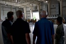 Nathan Garland, Clayton Garland, Louis Garland, decedents of late Chief Warrant Officer Louis F. Garland, and U.S. Air Force Master Sgt. Roy Campos, 312th Training Squadron advance courses chief, watch trainees in the Louis F. Garland Department of Defense Fire Academy on Goodfellow Air Force Base, Texas, July 13, 2018. The trainees train in full firefighting gear to prepare them for their careers. (U.S. Air Force photo by Senior Airman Randall Moose/Released)