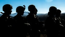 U.S. Marines with 1st Tanks Battalion, 1st Marine Division (MARDIV), listen to a safety brief during the Rifle Squad Competition on Marine Corps Base Camp Pendleton, Calif., June 27, 2018.