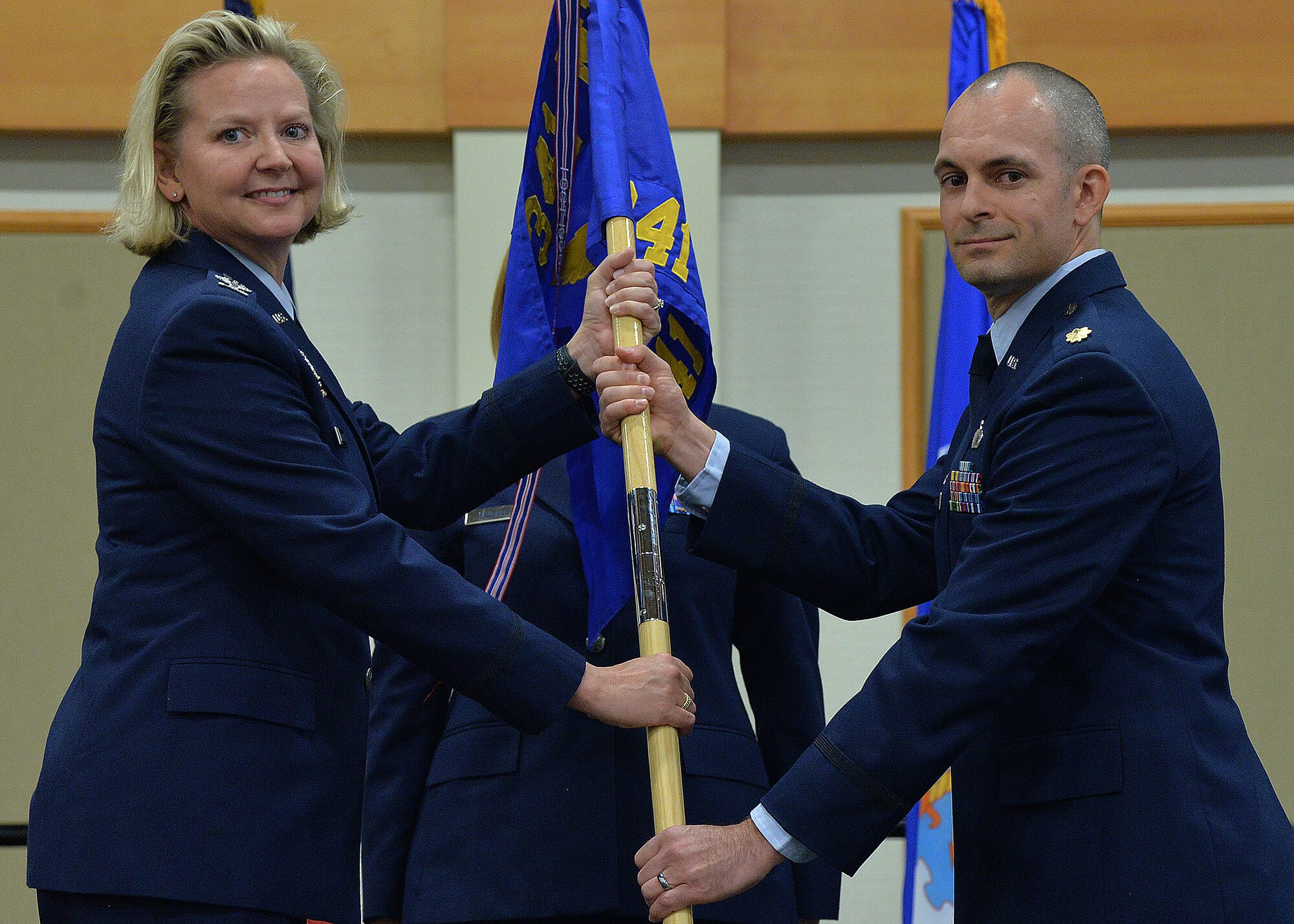 Maj. Darren Mattheis, right, accepts command of the 341st Comptroller Squadron from Col. Jennifer Reeves, 341st Missile Wing commander during a change of command ceremony July 16, 2018, at the Grizzly Bend on Malmstrom AFB, Mont.