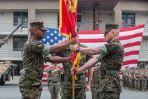 U.S. Marine Corps Lt. Col. Dominique B. Neal, left, the incoming commanding officer, recieves the battalion colors from Lt. Col. Michael R. Nakonieczy, right, the offgoing commanding officer, during the 1st Light Armored Reconnaissance Battalion, 1st Marine Division, change of command ceremony at Marine Corps Base Camp Pendleton, Calif., June 21, 2018.