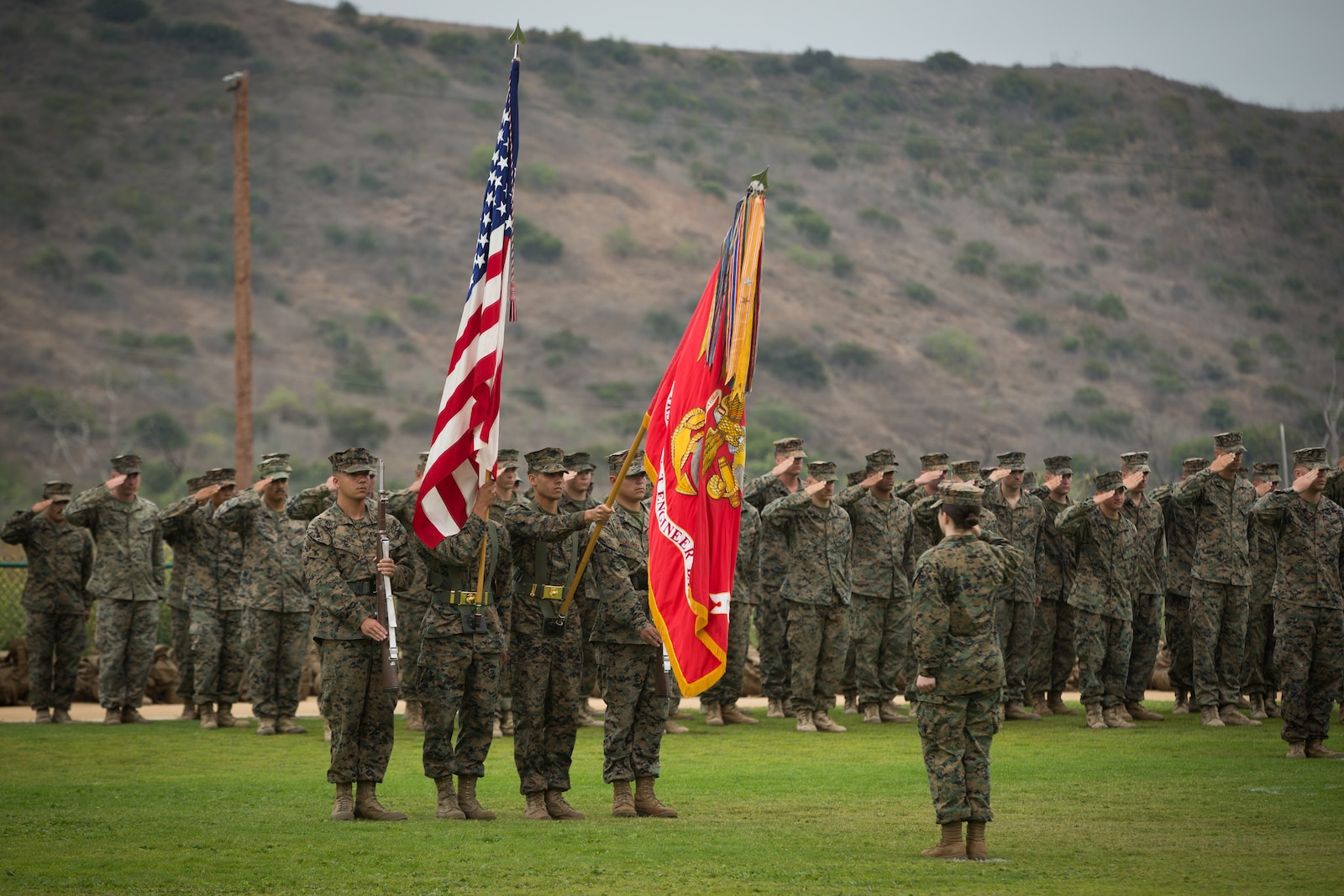 U.S. Marine Corps color guard with 1st Combat Engineer Battalion (CEB), 1st Marine Division, present the colors during a change of command ceremony at Marine Corps Base Camp Pendleton, Calif., June 22, 2018.