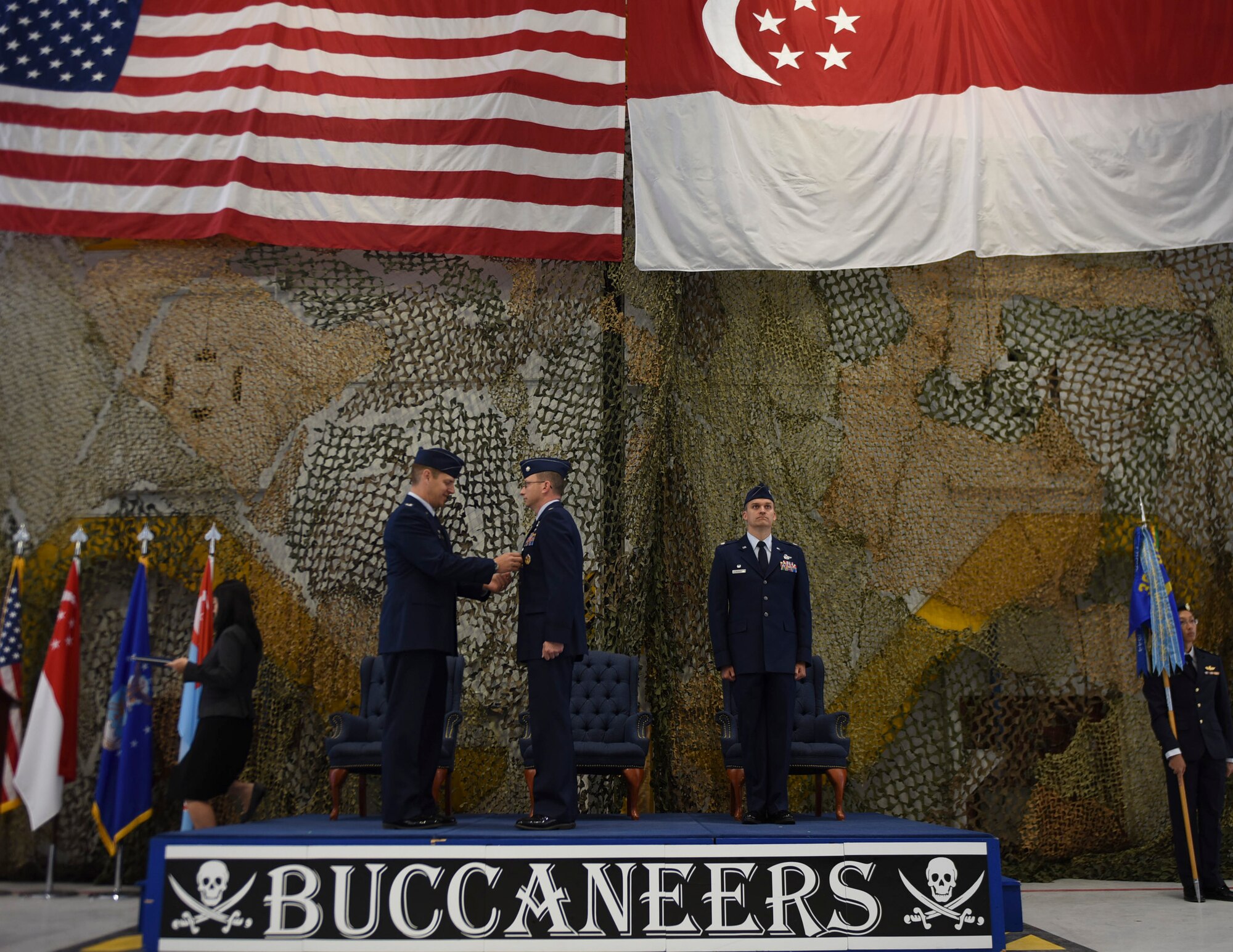 Image of Col. Joe Kunkel, 366th Fighter Wing commander, pins a Meritorius Service medal on Lt. Col. Donald Sandberg, former 428th Fighter Squadron commander, June, 29, 2018, at Mountain Home Air Force Base Idaho. As commander of the 428th FS, Sandberg successfully led (approximately) a 300-person international partnership and managed a $73 million flying hour program. (U.S. Air Force photo by Senior Airman Alaysia Berry)
