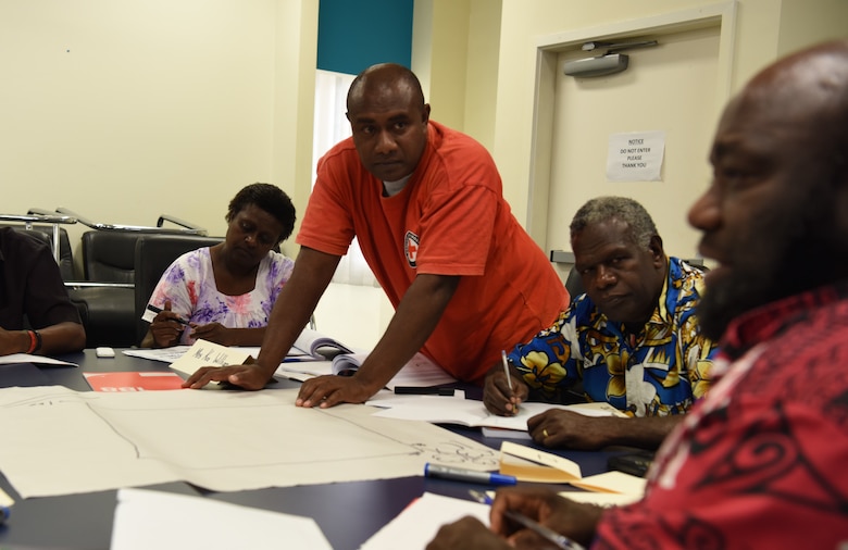 Emergency professionals from Luganville, Espiritu Santo Island and Tanna, Tanna Island, Vanuatu, participate in a disaster response simulation activity during a subject matter exchange on community disaster response as part of Pacific Angel (PAC ANGEL) 18-3 in Luganville, Vanuatu, July 11, 2018.