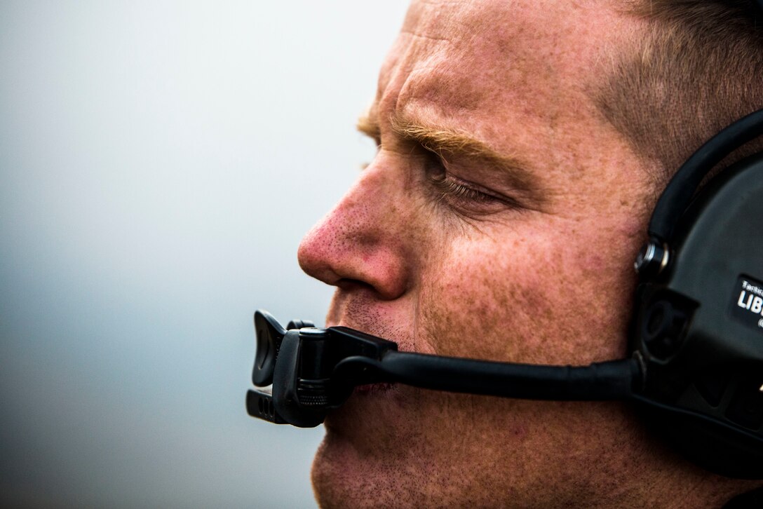 U.S. Marine Corps Capt. Rowdy Meinen, assistant air officer with 3rd Marine Regiment, relays coordinates during an air assault training event as part of Rim of the Pacific (RIMPAC) exercise at Pohakuloa Training Area, Hawaii, July 14, 2018. Meinen is the officer in charge of the joint forward air controller, which helps coordinate the close air support of ground troops.