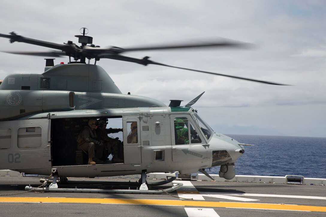 A U.S. Marine Corps UH-1Y Huey helicopter prepares to depart the amphibious assault ship USS Bonhomme Richard (LHD 6) during Rim of the Pacific (RIMPAC) exercise at sea off the coast of Hawaii July 11, 2018. U.S. Marine Corps Col. Michael S. Styskal, commanding officer, 3rd Marine Regiment, visits with the Marines and Sailors aboard the Bonhomme Richard while at sea.