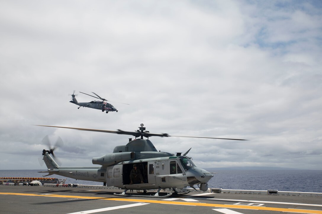 A U.S. Marine Corps UH-1Y Huey helicopter prepares to depart the amphibious assault ship USS Bonhomme Richard (LHD 6) during Rim of the Pacific (RIMPAC) exercise at sea off the coast of Hawaii July 11, 2018. U.S. Marine Corps Col. Michael S. Styskal, commanding officer, 3rd Marine Regiment, visits with the Marines and Sailors aboard the Bonhomme Richard while at sea.