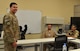 U.S. Air Force Capt. Christopher Bowser, Air Forces Central Command Coalition Coordination Cell deputy chief, talks with Coalition partners attending the Senior Planner Course, July 2, 2018 at Al Udeid Air Base, Qatar. Bowser is a fifth grade math and science teacher in western Pennsylvania.  (U.S. Air Force photo by Staff Sgt. Stephanie Serrano)