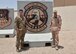 U.S. Air Force Capt. Christopher Bowser, Air Forces Central Command Coalition Coordination Cell deputy chief, takes a photo in front of the Combined Air and Space Operations Center, July 2, 2018 at Al Udeid Air Base, Qatar. This is Bowser’s first deployment since he began teaching at Baden Academy Charter School in Beaver County, Pennsylvania.  (U.S. Air Force photo by Staff Sgt. Stephanie Serrano)