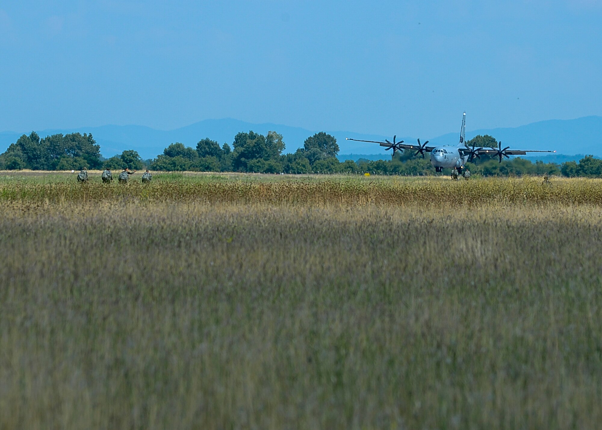 A U.S. Air Force C-130J Super Hercules aircraft lands during Thracian Summer 2018 after performing a personnel drop with Bulgarians in Plovdiv, Bulgaria, July 13, 2018. During the exercise, the 37th Airlift Squadron worked on personnel and equipment airdrops both during day and night operations. (U.S. Air Force photo by Staff Sgt. Jimmie D. Pike)