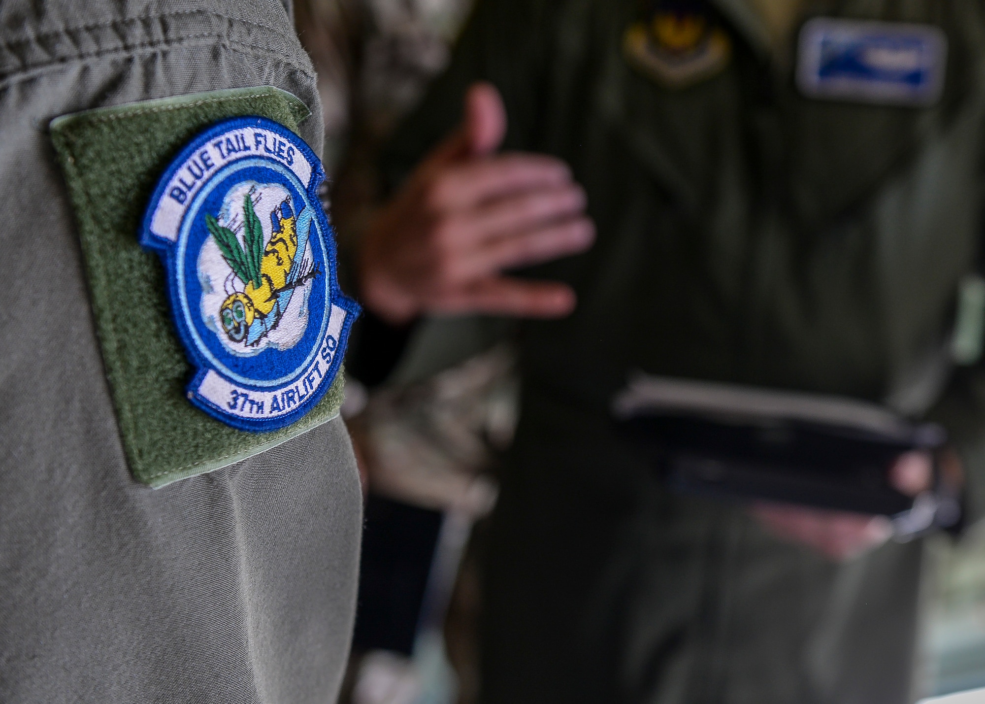 A 37th Airlift Squadron patch rests on the shoulder of a member of the unit at Plovdiv, Bulgaria, July 14, 2018. The 37th AS facilitated training with Bulgarian partners during Thracian Summer 2018, a forward training deployment, which aims to build trusted relationships and interoperability. (U.S. Air Force photo by Staff Sgt. Jimmie D. Pike)