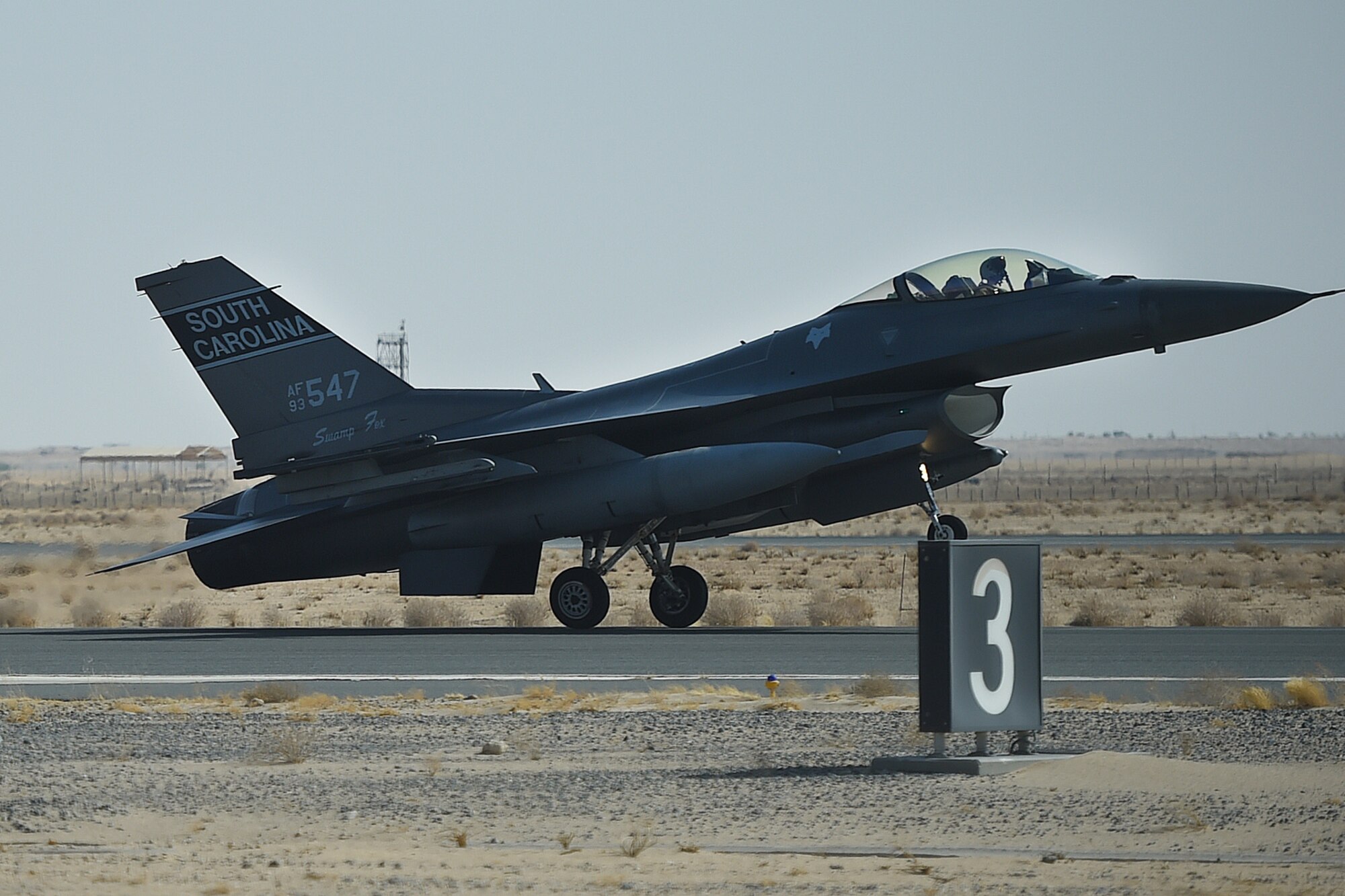 A jet lands on a runway