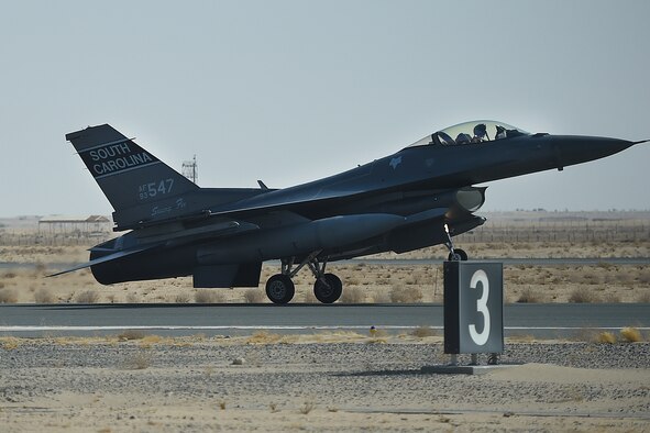 A jet lands on a runway