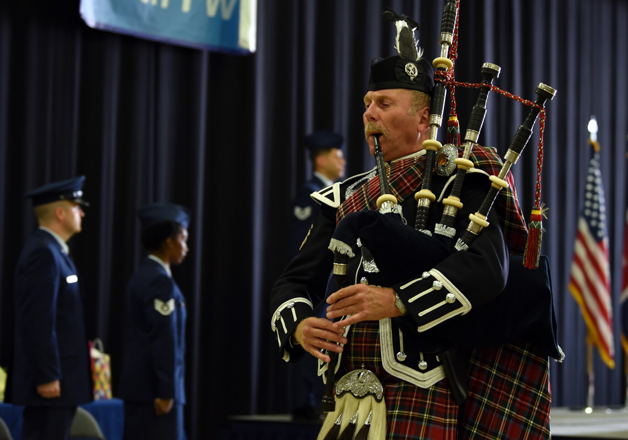 Mr. Dave Harper plays Highland Laddie during the 48th Fighter Wing change of command ceremony at Royal Air Force Lakenheath, England, July 16, 2018. More than 400 Airmen, civil service employees and host nation visitors attended the ceremony to witness Col. William L. Marshall assume command from Col. Evan L. Pettus. (U.S. Air Force photo by Staff Sgt. Alex Fox Echols III)