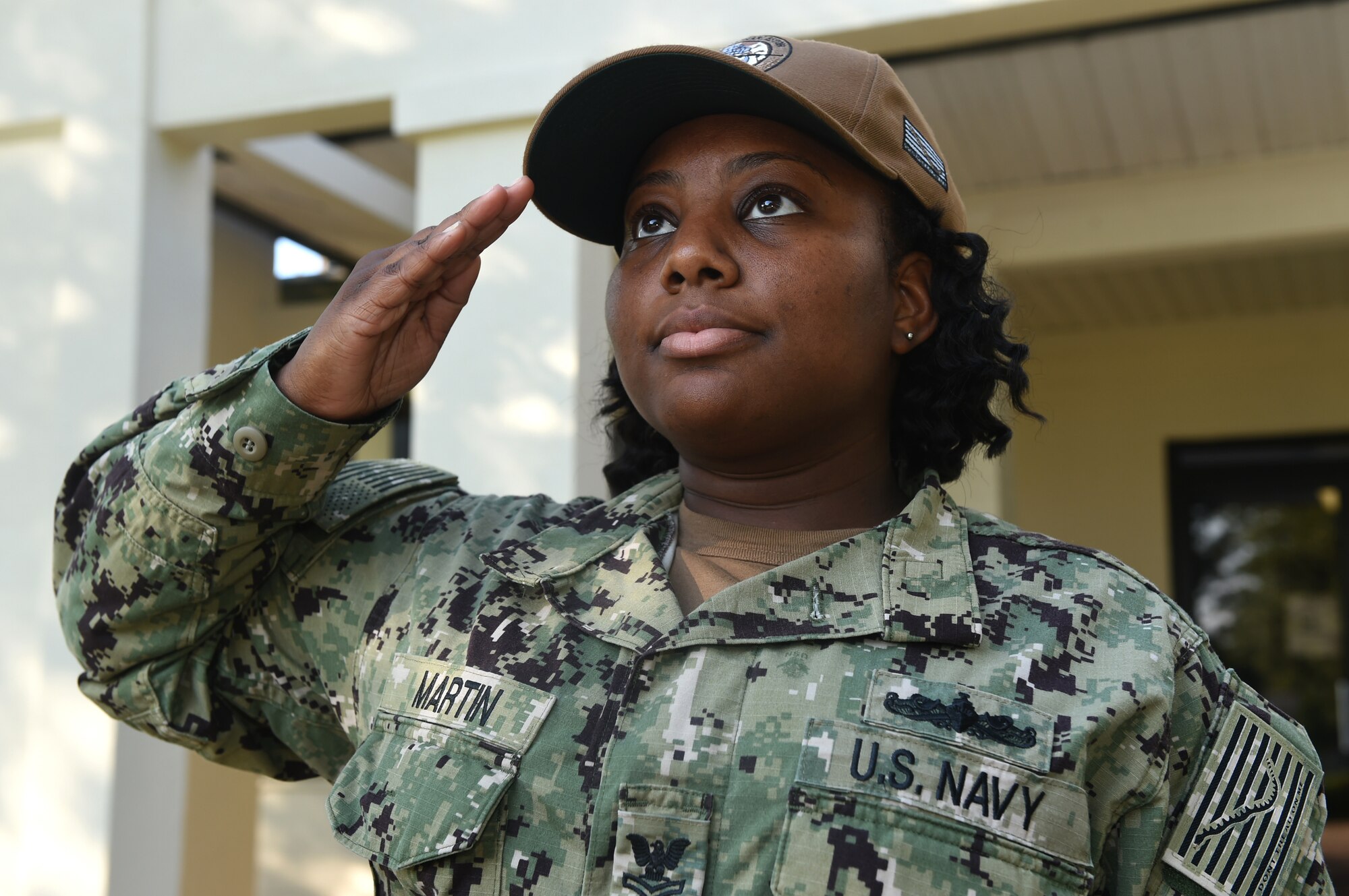 U.S. Navy Ships Serviceman 1st Class La’Tasha Martin, Naval Support Activity Charleston unaccompanied personnel housing office, salutes the American Flag at Joint Base Charleston’s Naval Weapons Station June 20, 2018. Martin was the one Sailor selected through the Meritorious Advancement Program at NSA Charleston to be advanced to the paygrade of E6 this year. The MAP is intended to give commanders the opportunity to recognize their best Sailors and shape their workforce by developing and rewarding their most talented enlisted members.