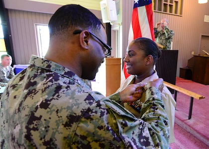 U.S. Navy Ships Serviceman 1st Class La’Tasha Martin, right, Naval Support Activity Charleston unaccompanied personnel housing office, is meritoriously advanced to the paygrade of E-6 during a promotion ceremony at Joint Base Charleston’s Naval Weapons Station June 20, 2018. Martin was the one Sailor selected through the Meritorious Advancement Program at NSA Charleston to be advanced to the paygrade of E6 this year. The MAP is intended to give commanders the opportunity to recognize their best Sailors and shape their workforce by developing and rewarding their most talented enlisted members.