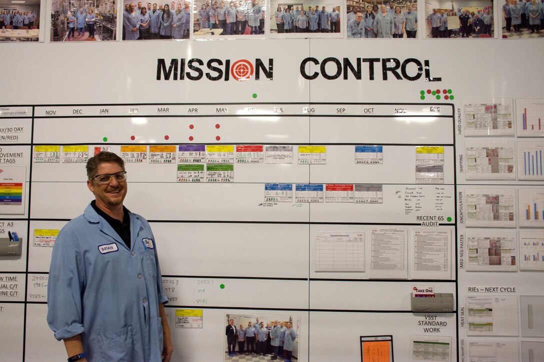 Roush stands next to the Enersys "mission control" board.