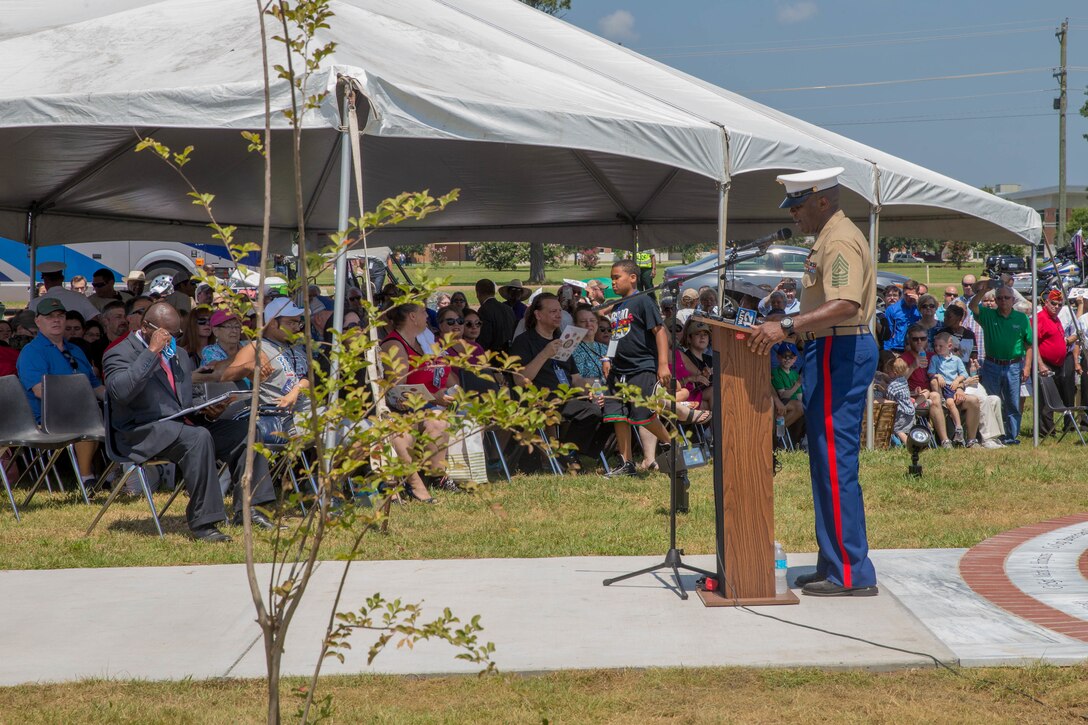 Sgt. Maj. Ronald L. Green, 18th sergeant major of the Marine Corps, addresses the loved ones, community members and distinguished visitors, who gather at the Memorial Marker dedicated to honor the sacrifice of the fallen passengers and crew of Yanky 72, during the Memorial Ceremony, July 14, 2018. The Yanky 72 Memorial Ceremony was held to remember and honor the ultimate sacrifices made by the fallen Marines and Sailor of VMGR-452 and Marine Corps Special Operations Command. (U.S. Marine Corps photo by Lance Cpl. Samantha Schwoch/released)