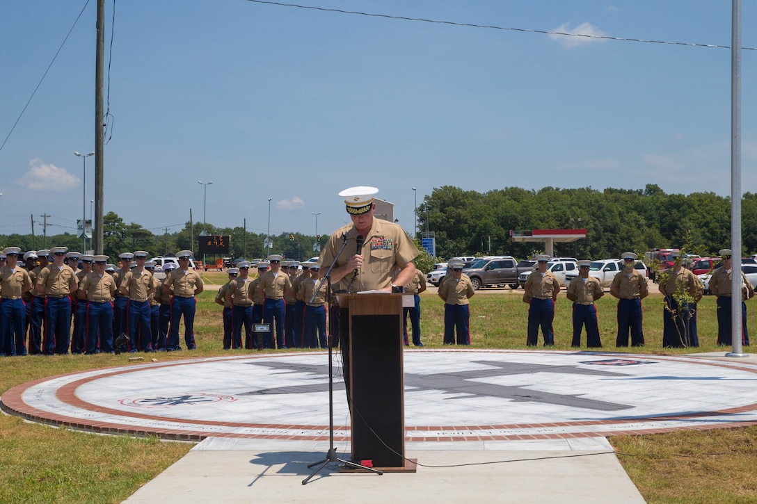 Brig. Gen. Bradley James, commanding general of 4th Marine Aircraft Wing, addresses the loved ones, community members and distinguished visitors, who gather at the Memorial Marker dedicated to honor the sacrifice of the fallen passengers and crew of Yanky 72, during the Memorial Ceremony, July 14, 2018. The Yanky 72 Memorial Ceremony was held to remember and honor the ultimate sacrifices made by the fallen Marines and Sailor of VMGR-452 and Marine Corps Special Operations Command. (U.S. Marine Corps photo by Lance Cpl. Samantha Schwoch/released)