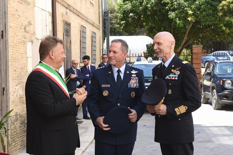U.S. Chief of Staff of the Air Force Gen. David L. Goldfein speaks with Lucera Mayor Antonio Tutolo (left) and Italian Air Force Chief of Staff Lt. Gen. Enzo Vecciarelli (right), following a ceremony July 7, 2018, where Goldfein was named an honorary citizen of the Italian city of Lucera. Goldfein was the first foreign citizen to receive the distinction. (Courtesy photo)