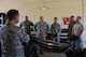 U.S. Air Force Chief Master Sgt. Daniel Hoglund, 20th Fighter Wing command chief, left, speaks with 20th Equipment Maintenance Squadron (EMS) conventional maintenance flight Airmen during a visit to their shop at Shaw Air Force Base, S.C., July 10, 2018.