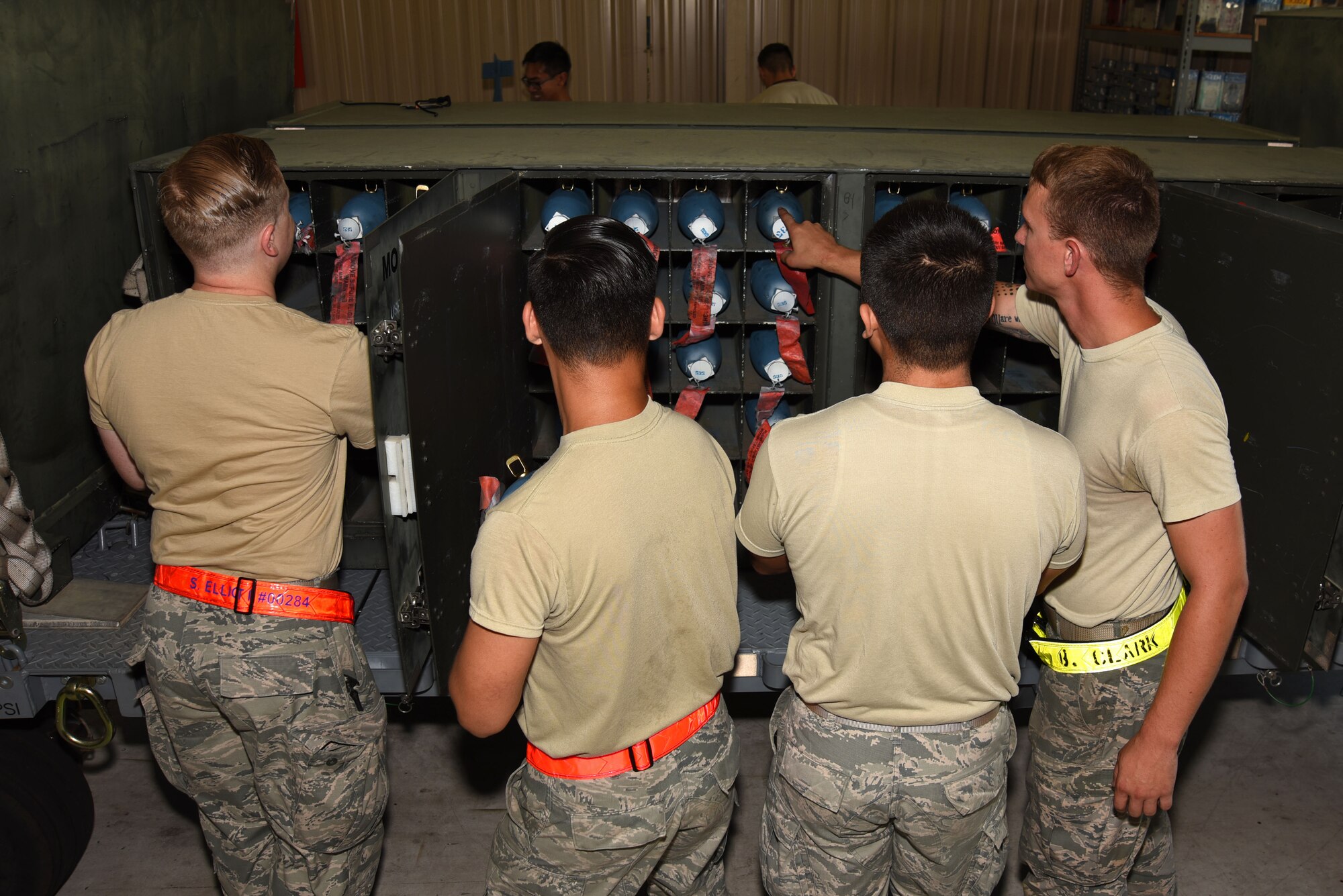 U.S. Airmen assigned to the 20th Equipment Maintenance Squadron (EMS) conventional maintenance flight prepare BDU-33 practice bombs for transport at Shaw Air Force Base, S.C., July 10, 2018.