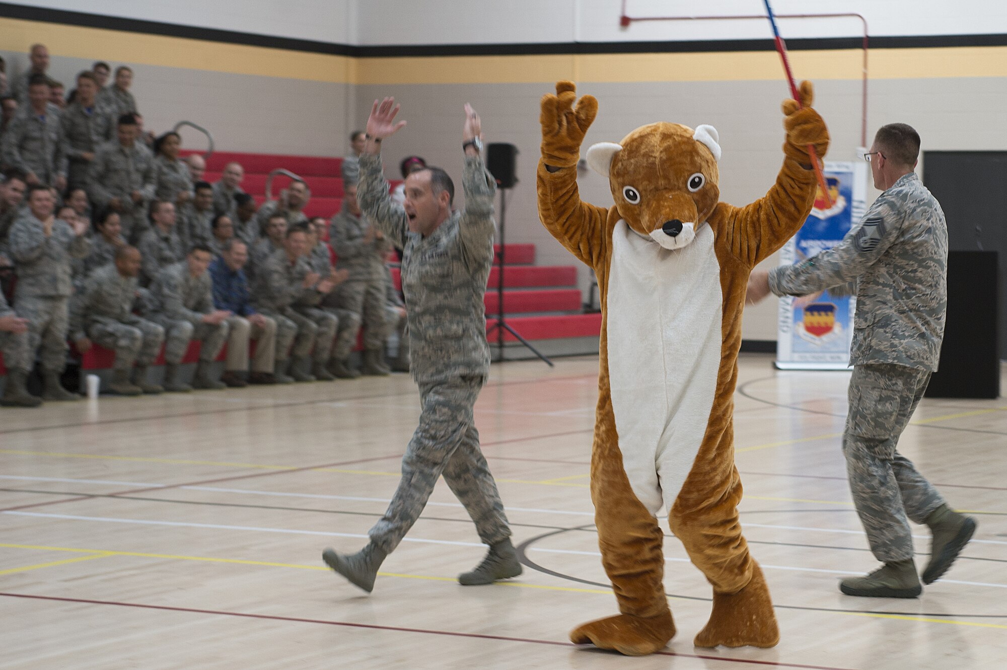 U.S. Air Force leaders assigned to the 20th Fighter Wing (FW) enter the Shaw main fitness center gymnasium in preparation for the wing’s first commander’s call with Col. Derek O’Malley, 20th FW commander, at Shaw Air Force Base, S.C., July 13, 2018.