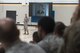 U.S. Air Force Col. Derek O’Malley, 20th Fighter Wing commander, speaks during his first commander’s call at Shaw Air Force Base, S.C., about his three basic command themes of unify, simplify and win, July 13, 2018.