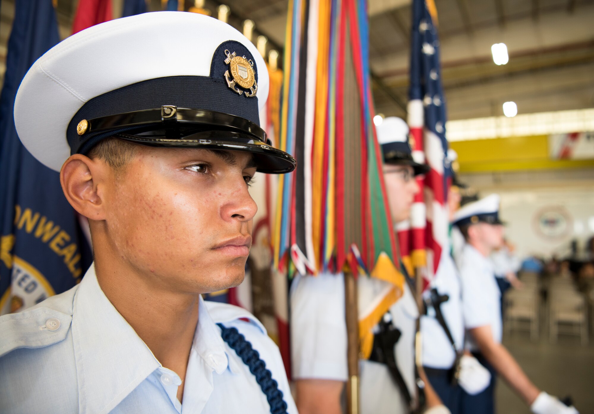 The color guard stands at attention before presenting the colors at the U.S. Coast Guard Atlantic Strike Team change of command ceremony on Joint Base McGuire-Dix-Lakehurst, N.J., July 12, 2018. The Atlantic Strike Team welcomed Cmdr. Raymond Negron who took command from Cmdr. Tedd Hutley. (U.S. Air Force photo by Airman Ariel Owings)