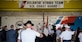 Members of the Joint Base McGuire-Dix-Lakehurst community pay their respect to the American flag during the National Anthem at the U.S. Coast Guard Atlantic Strike Team change of command ceremony on Joint Base MDL, N.J., July 12, 2018. Recognized by law in 1931, all members of the armed forces and veterans salute during the National Anthem while civilians place their hand over the heart. (U.S. Air Force photo by Airman Ariel Owings)