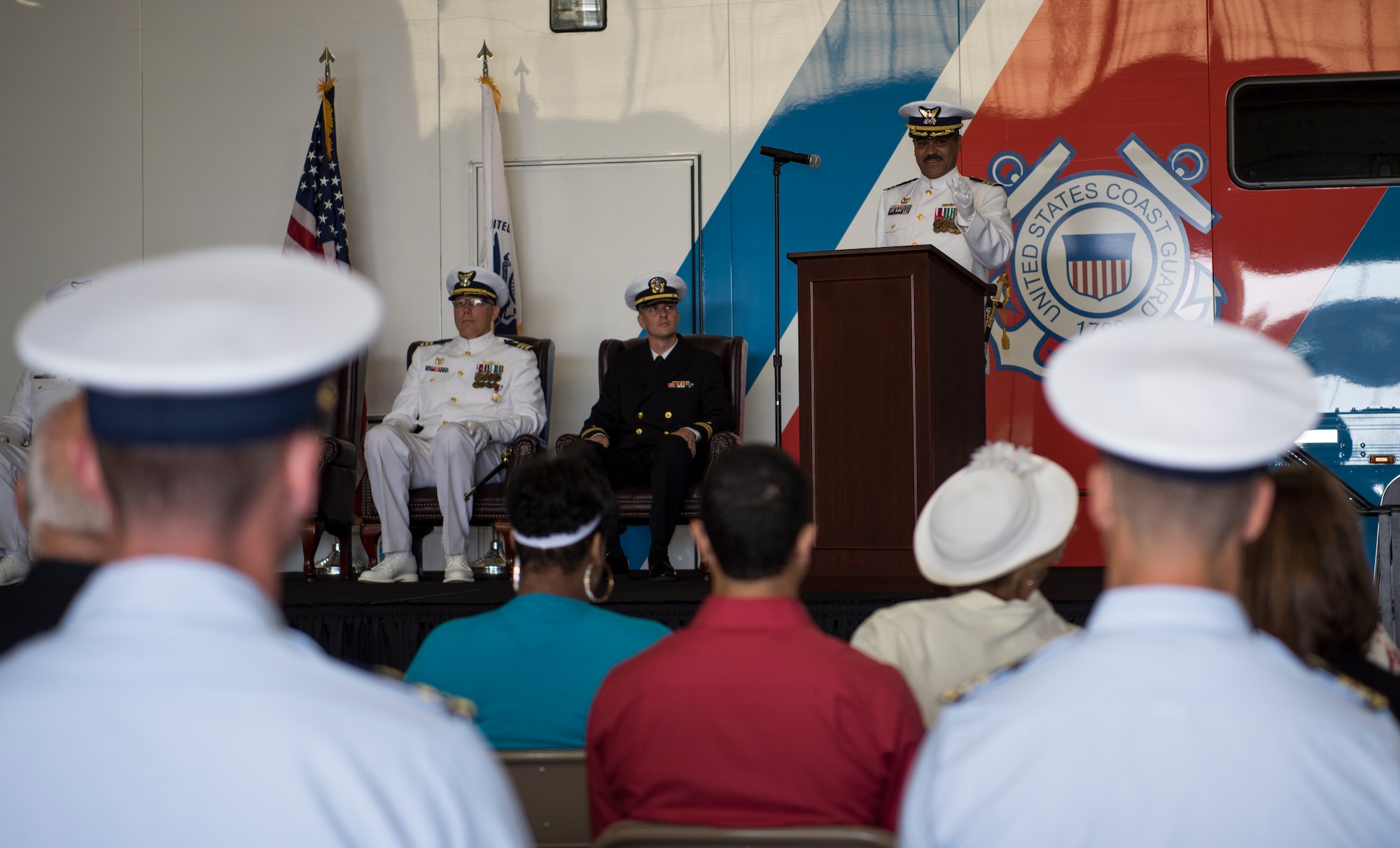 Cmdr. Raymond Negron, incoming U.S. Coast Guard Atlantic Strike Team commanding officer, gives a speech during the change of command ceremony on Joint Base McGuire-Dix-Lakehurst, N.J., July 12, 2018. Negron spoke of his gratefulness for the welcome he has received at Joint Base MDL and the hope he has for the future of the Atlantic Strike Team. (U.S. Air Force photo by Airman Ariel Owings)
