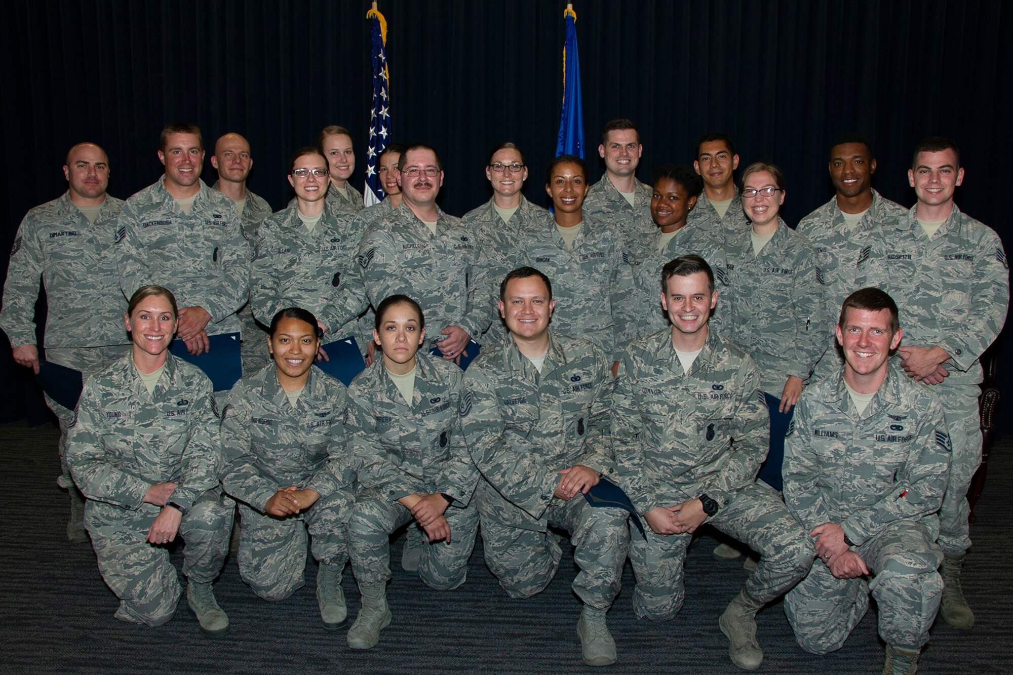 A graduating class of 21 Reserve Citizen Airmen pose for a photo after completing the Air Force Reserve Command’s Noncommissioned Officer Leadership Development Course, July 13, 2018, at Peterson Air Force Base, Colorado.