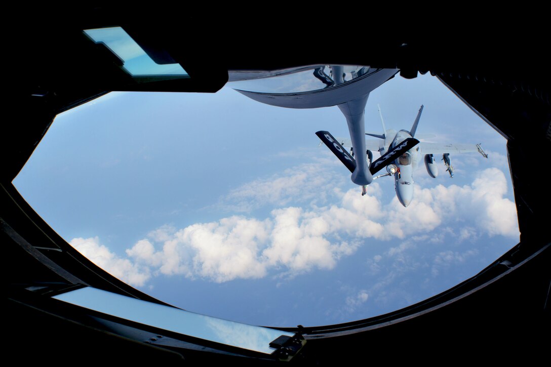 A U.S. Marine Corps F/A-18 Super Hornet from the Marine All-Weather Fighter Attack Squadron 533, based out of Marine Corps Air Station Beaufort, South Carolina, refuels over the Pacific Ocean from a 507th Air Refueling Wing KC-135R Stratotanker from Tinker Air Force Base, Oklahoma, during the Rim of the Pacific (RIMPAC) exercise, July 10.  Twenty-five nations, 46 ships, five submarines, and about 200 aircraft and 25,000 personnel are participating in RIMPAC from June 27 to Aug. 2 in and around the Hawaiian Islands and Southern California. The world’s largest international maritime exercise, RIMPAC provides a unique training opportunity while fostering and sustaining cooperative relationships among participants critical to ensuring the safety of sea lanes and security of the world’s oceans. RIMPAC 2018 is the 26th exercise in the series that began in 1971. (U.S. Air Force photo by Tech. Sgt. Samantha Mathison)