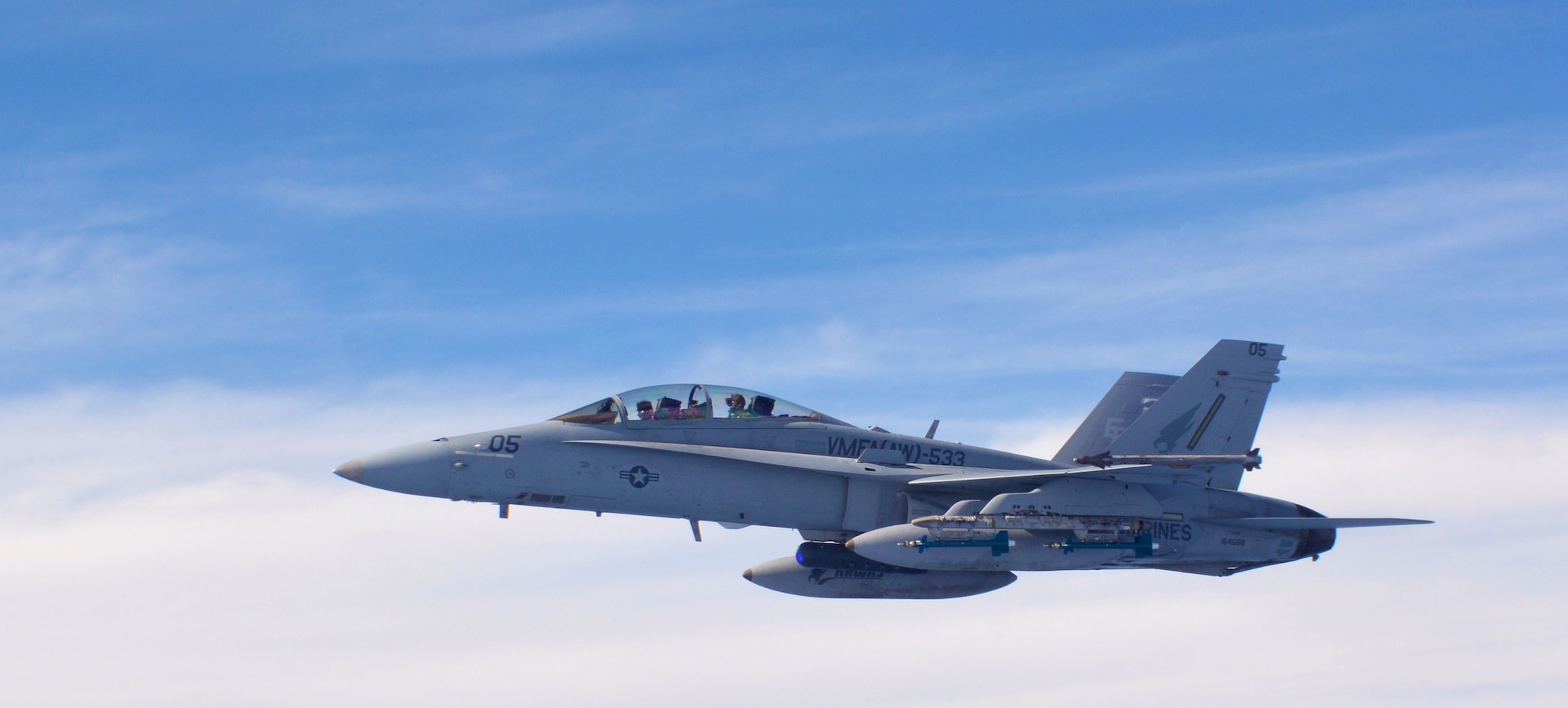A U.S. Marine Corps F/A-18 Super Hornet from the Marine All-Weather Fighter Attack Squadron 533, based out of Marine Corps Air Station Beaufort, South Carolina, flies over the Pacific Ocean alongside a 507th Air Refueling Wing KC-135R Stratotanker from Tinker Air Force Base, Oklahoma, during the Rim of the Pacific (RIMPAC) exercise, July 10. Twenty-five nations, 46 ships, five submarines, and about 200 aircraft and 25,000 personnel are participating in RIMPAC from June 27 to Aug. 2 in and around the Hawaiian Islands and Southern California. The world’s largest international maritime exercise, RIMPAC provides a unique training opportunity while fostering and sustaining cooperative relationships among participants critical to ensuring the safety of sea lanes and security of the world’s oceans. RIMPAC 2018 is the 26th exercise in the series that began in 1971. (U.S. Air Force photo by Tech. Sgt. Samantha Mathison)