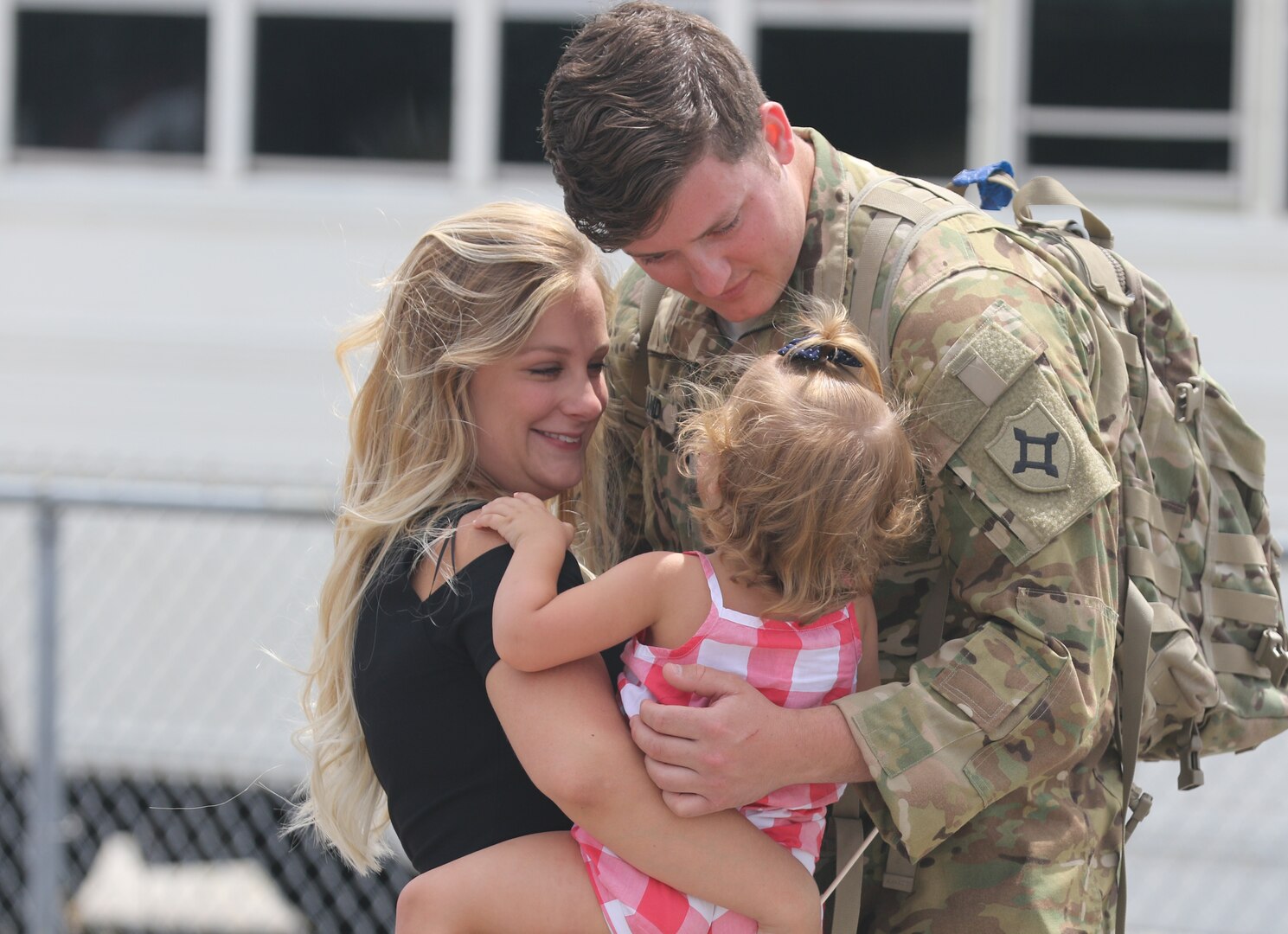 Spc. Alexander Rowland greets his wife, Christine Rowland, and daughter at Jacksonville International Airport near Jacksonville, Florida, on April 29, 2017. A crew chief with the Florida National Guard's 1st Battalion, 111th Aviation Regiment, General Support Aviation Battalion, Spc. Rowland has just returned from an 11-month deployment to Kuwait. Soldiers who are nearing retirement should consider participating in the Survivor Benefit Plan, which provides a monthly annuity to the spouse and/or children of a retiree who dies.
