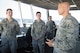 Maj. Gen. Bradley D. Spacy, Air Force Installation and Mission Support Center commander, speaks with 88th Operations Support Squadron Air Traffic Controllers Senior Airman Austin Wisialowski and Airman 1st Class Tyler Boatman in the Wright-Patterson Air Force Base control tower during a visit to the installation July 12, 2018