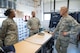 Wright-Patterson Air Force Base Honor Guard member Tech. Sgt. Kalen Mack briefs Maj. Gen. Bradley D. Spacy, Air Force Installation and Mission Support Center commander, on Honor Guard uniforms alongside Honor Guard Superintendent Master Sgt. LaDonna Ford during the general's visit to the installation July 12, 2018.
