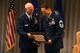 Chief Master Sgt. Robert L. Walter, 94th Force Support Squadron superintendent, receives a certificate from Brig. Gen. Richard L. Kemble, 94th Airlift Wing commander, during a retirement ceremony held here July 14. “Saying thanks for the last 36 years is just not enough, but I hope that I’ve worked with you long enough that I passed something along somewhere along the way,” Walter said. (U.S. Air Force photo/Senior Airman Josh Kincaid)