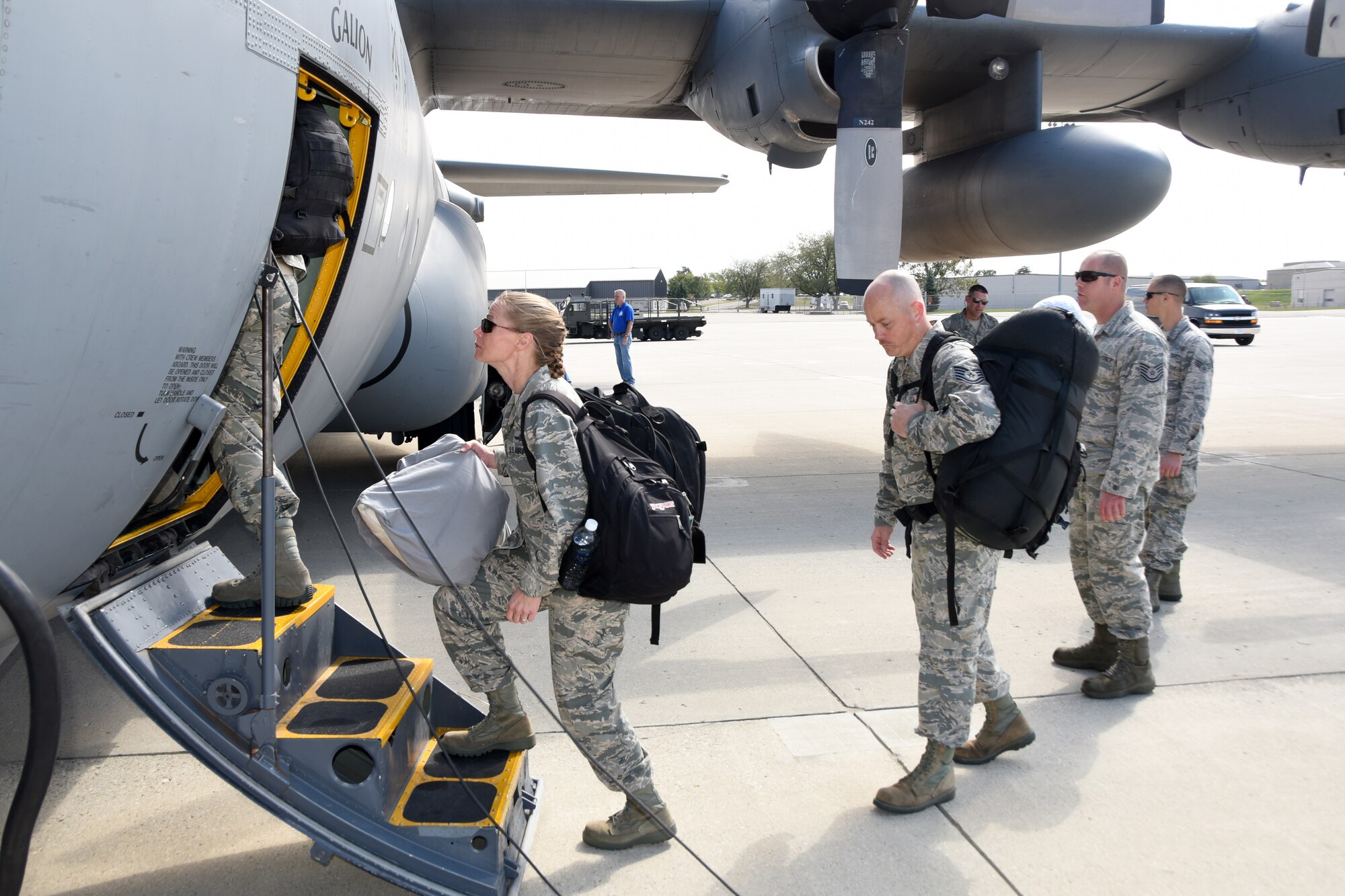 A seven-member team from 269th Combat Communications Squadron, Springfield Air National Guard Base, to include Lt. Col. Samantha Adducchio, 269th Commander, board a C-130 Hercules from the 179th Airlift Group, Mansfield, at Wright-Patterson Air Force Base, Ohio to provide tactical communications support to St. Thomas, U.S. Virgin Island in the aftermanth of recent hurricanes Sept. 29, 2017.